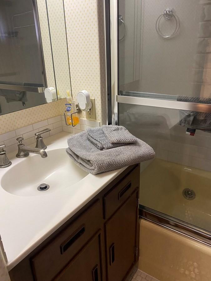 a bathroom with a sink and a mirror aboard VICTORY Yacht for Sale