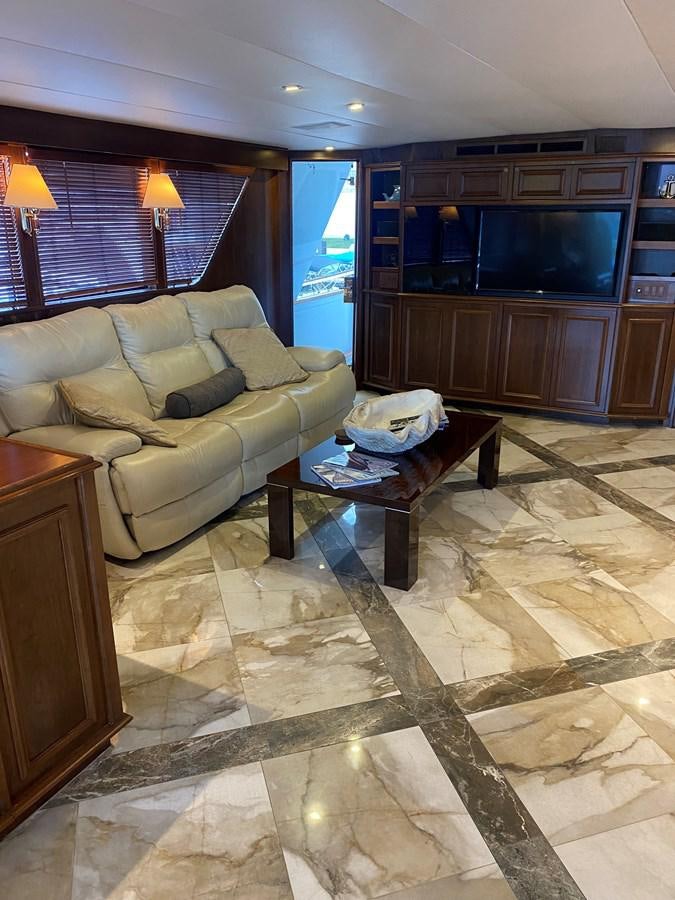 a living room with a couch and a coffee table aboard VICTORY Yacht for Sale