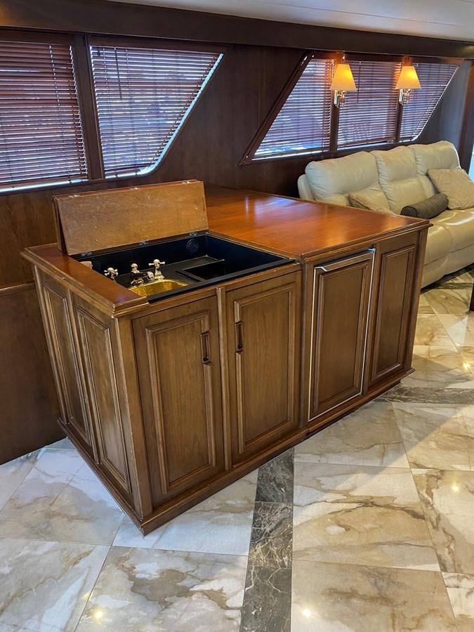a kitchen with a stove and a couch aboard VICTORY Yacht for Sale