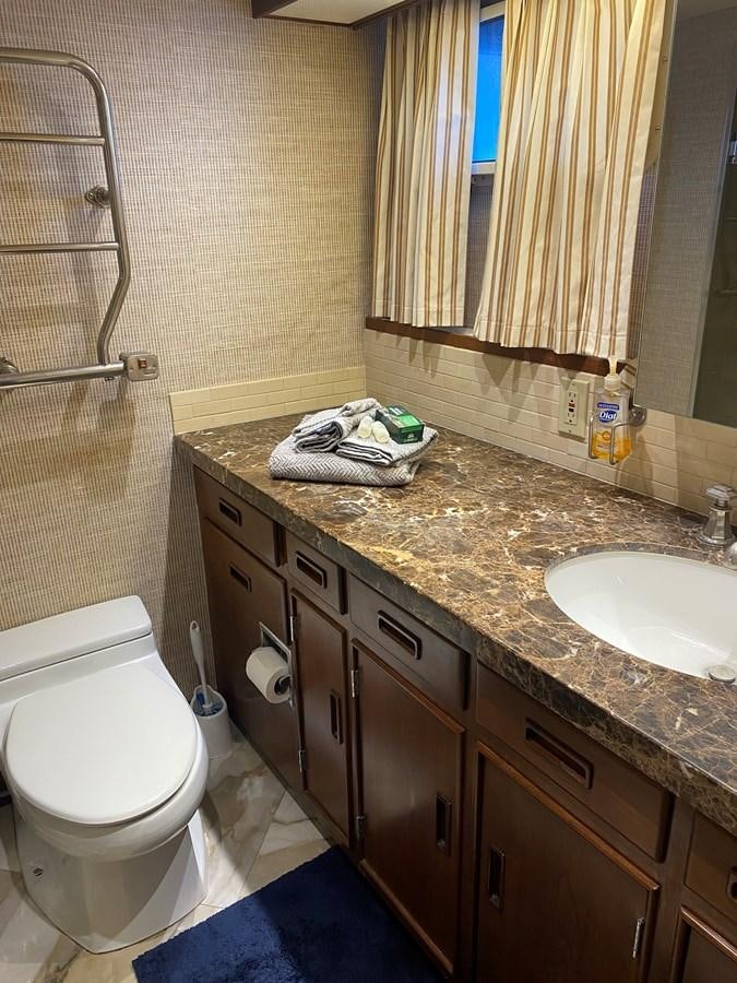 a bathroom with a toilet and sink aboard VICTORY Yacht for Sale