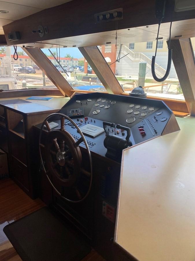 a steering wheel and dashboard of a car aboard VICTORY Yacht for Sale