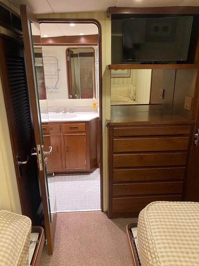 a kitchen with a microwave and cabinets aboard VICTORY Yacht for Sale