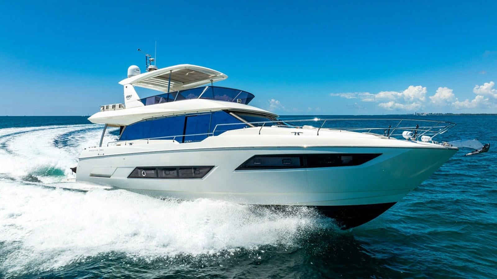 a white yacht on the water aboard YACHTOOMA Yacht for Sale