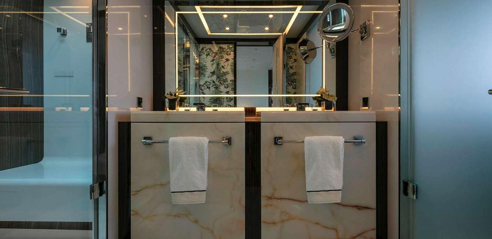 a bathroom with a large mirror aboard EL LEON Yacht for Sale