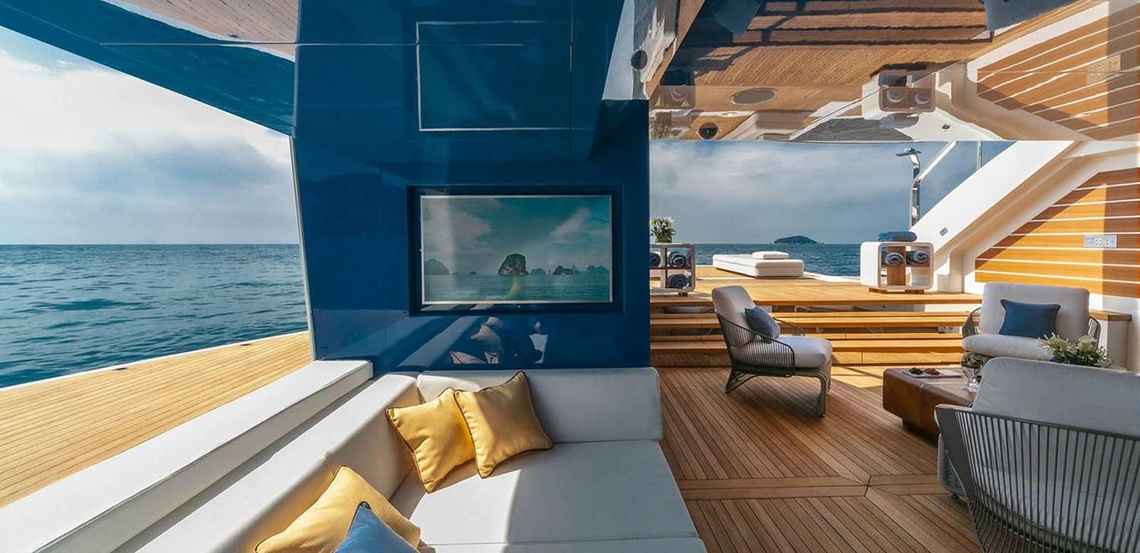 a room with a couch and a tv on the wall aboard EL LEON Yacht for Sale