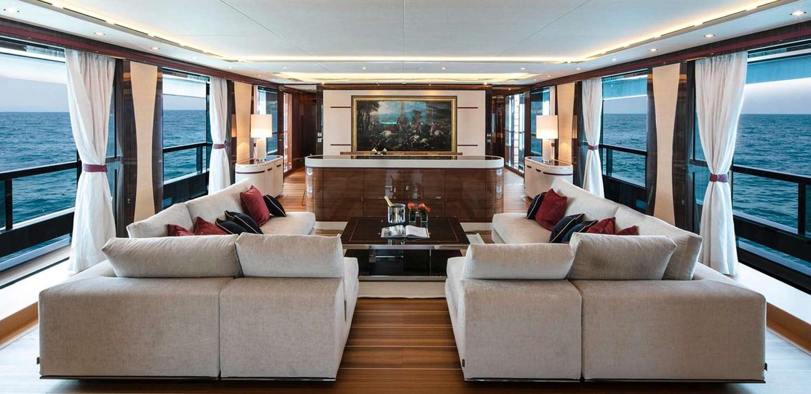 a living room with a fireplace aboard EL LEON Yacht for Sale