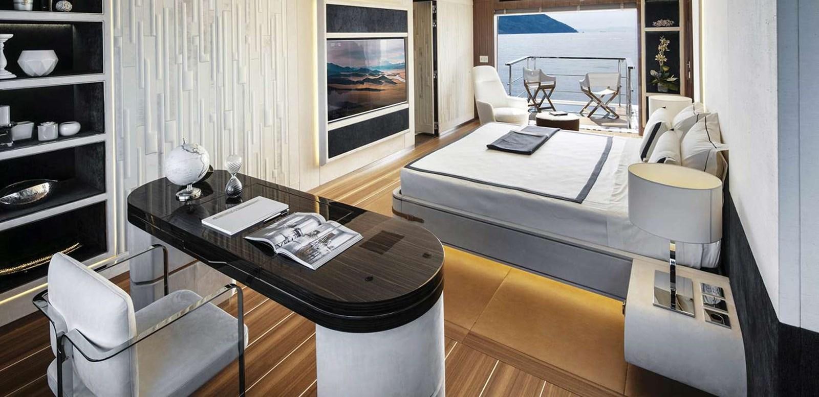 a room with a table and chairs aboard EL LEON Yacht for Sale