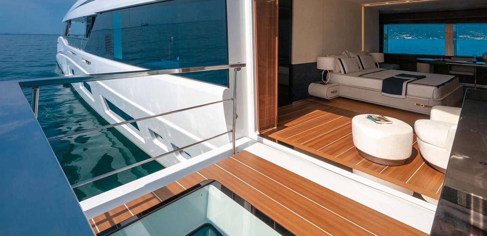 a room with a large bed and a large window aboard EL LEON Yacht for Sale