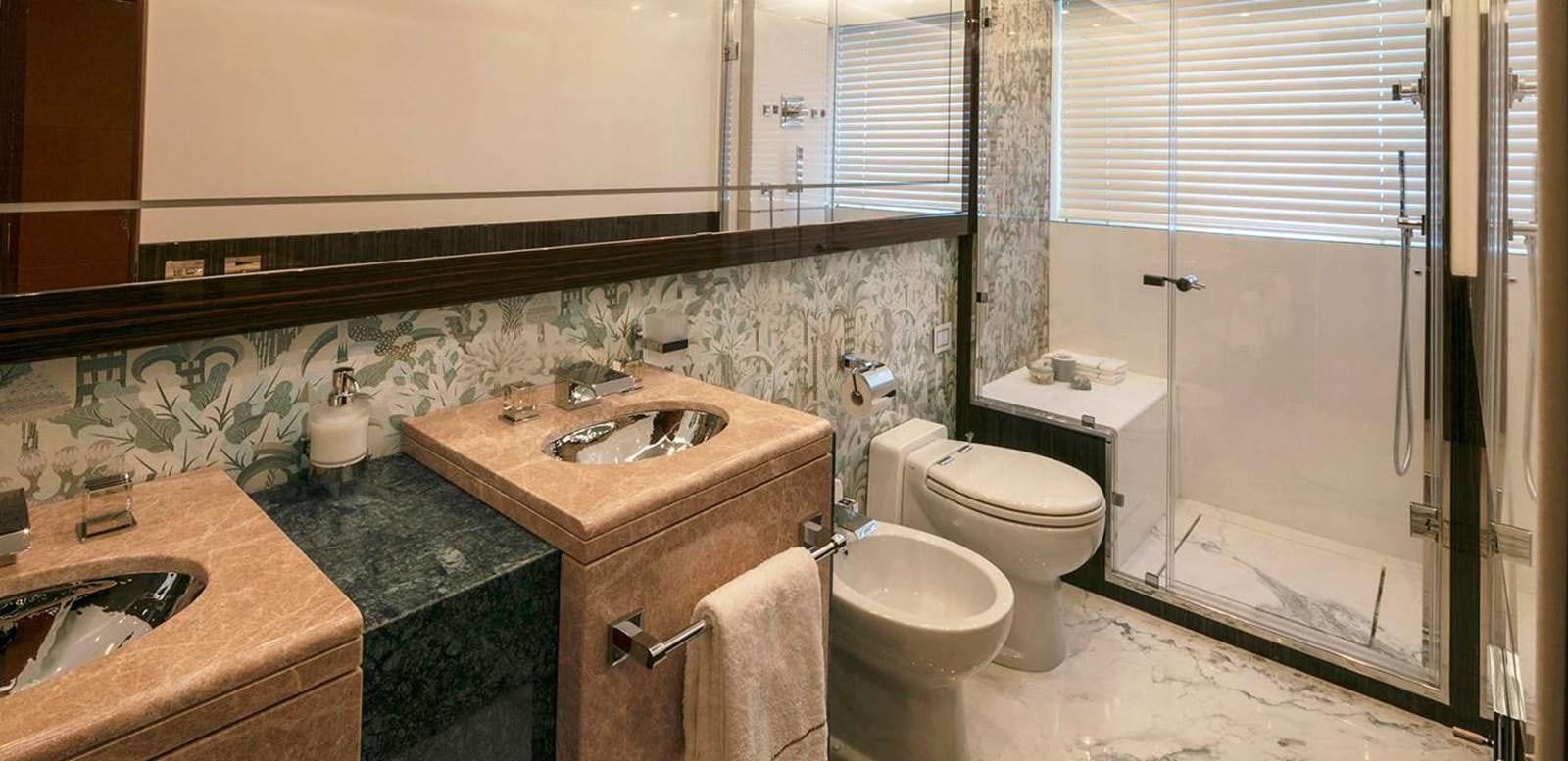 a bathroom with a sink toilet and a bathtub aboard EL LEON Yacht for Sale