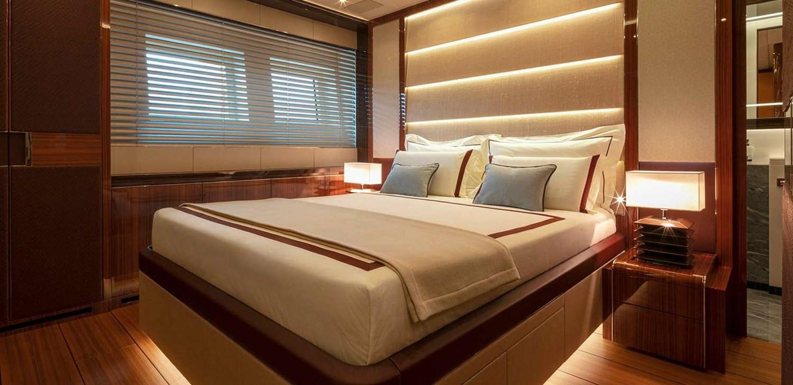 a bed with a white sheet aboard EL LEON Yacht for Sale