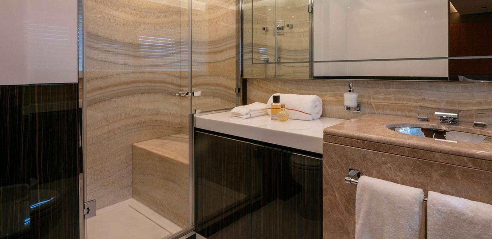 a bathroom with a sink and a mirror aboard EL LEON Yacht for Sale