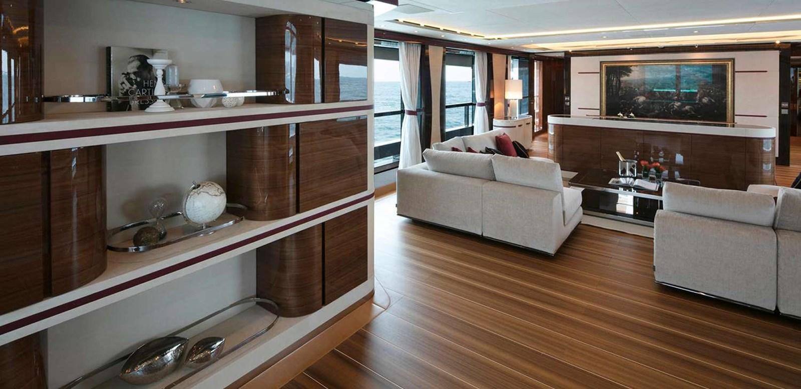 a living room with a large fireplace aboard EL LEON Yacht for Sale