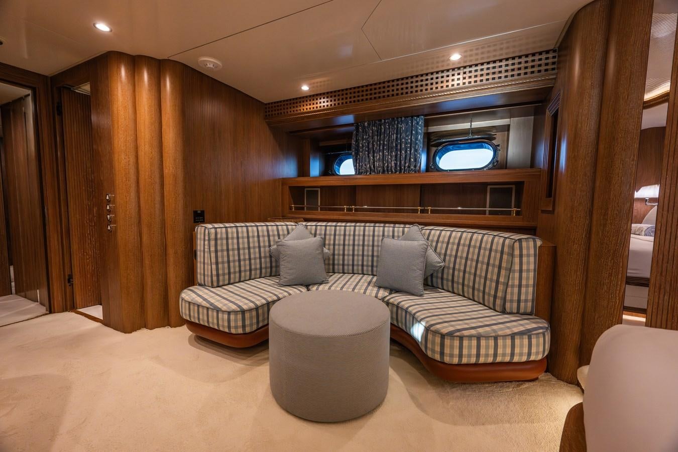 a couch in a room aboard TAIPAN OF WALES Yacht for Sale