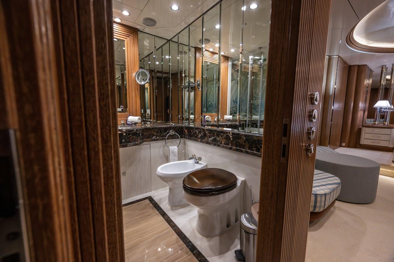 a bathroom with a glass shower aboard TAIPAN OF WALES Yacht for Sale