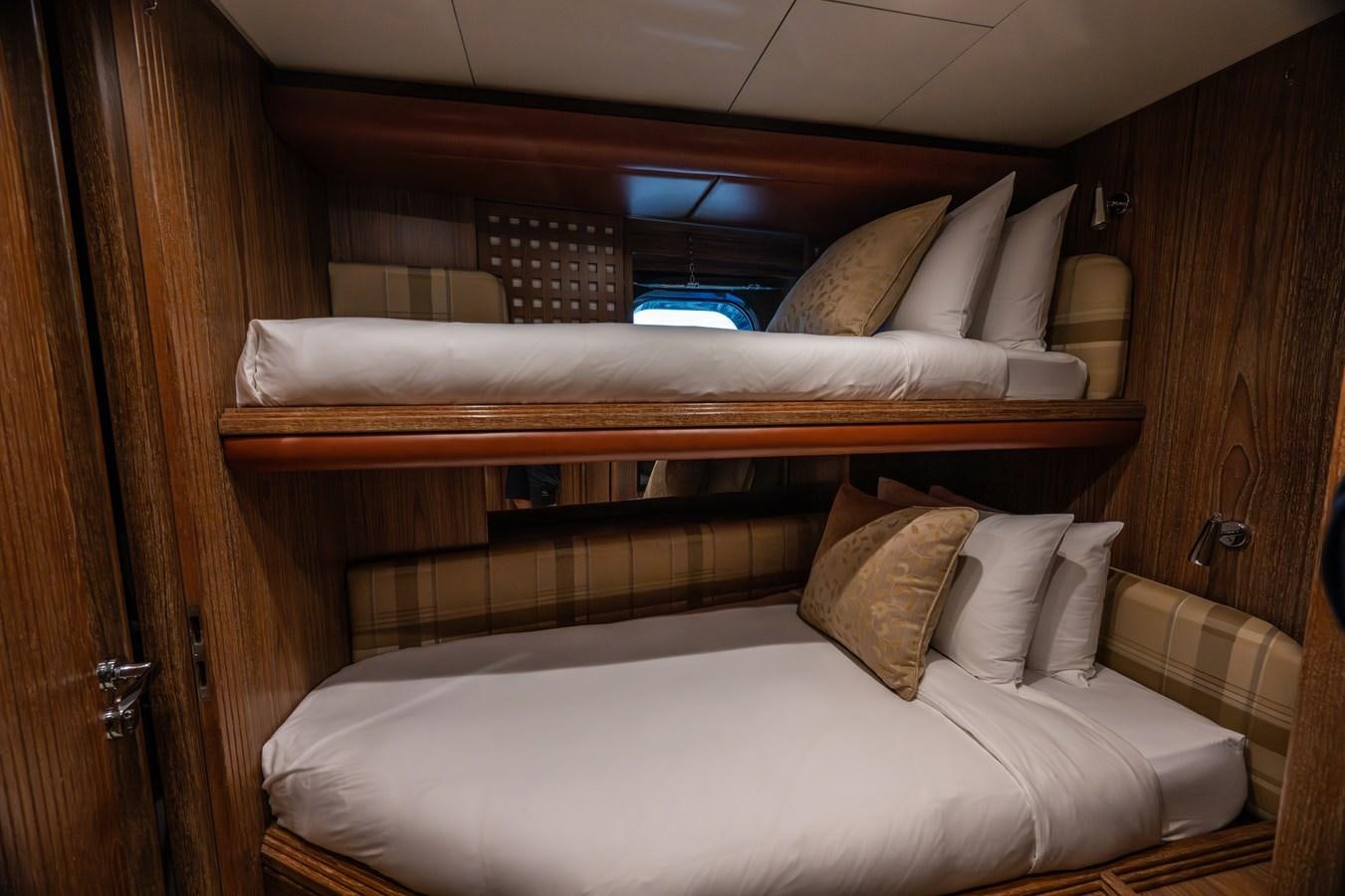 a bed with pillows aboard TAIPAN OF WALES Yacht for Sale