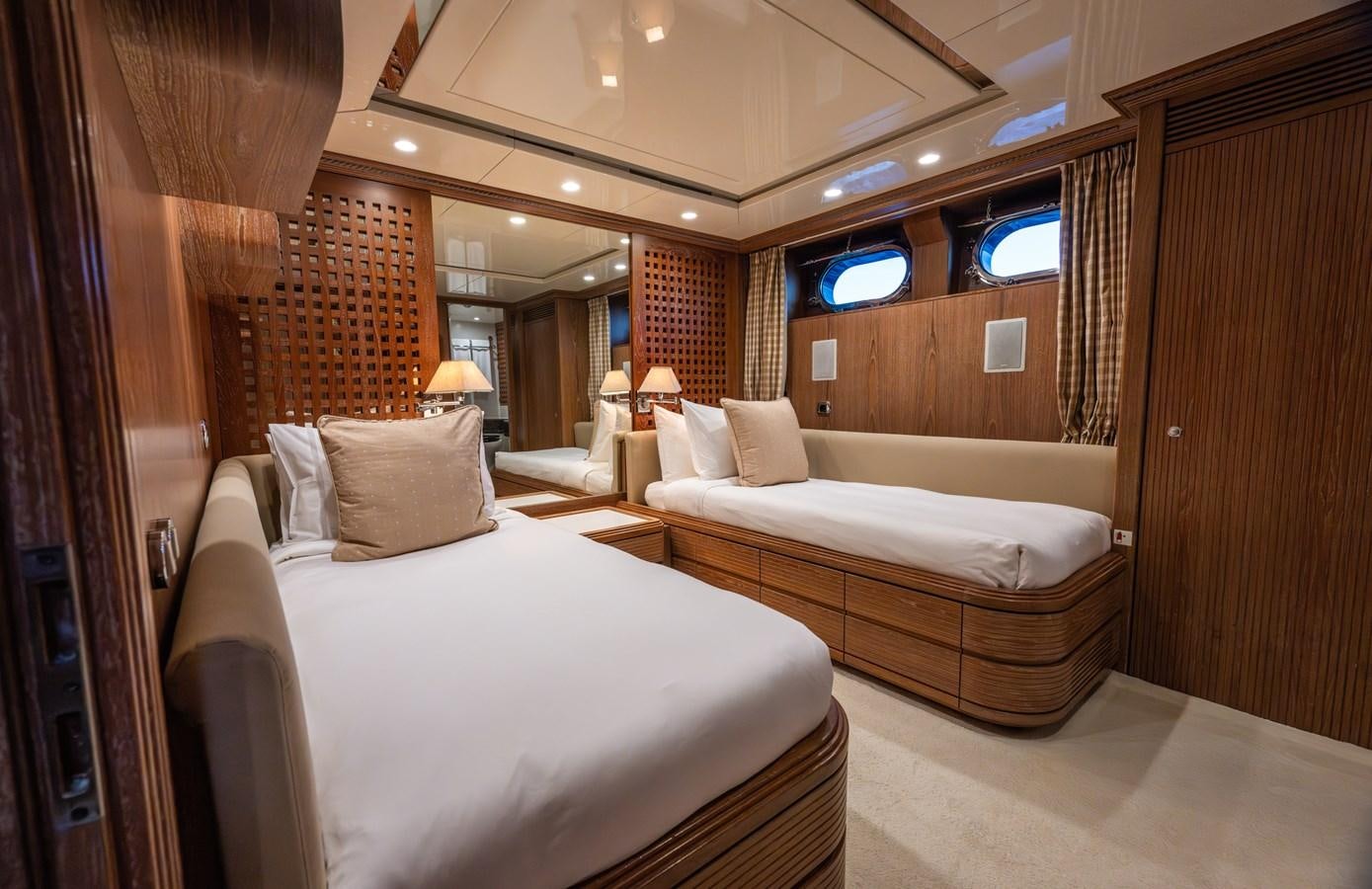 a room with a couple of beds aboard TAIPAN OF WALES Yacht for Sale