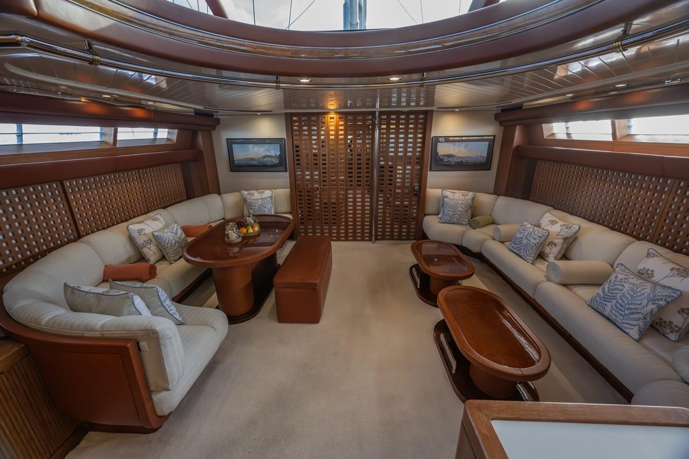 a living room with a large window aboard TAIPAN OF WALES Yacht for Sale