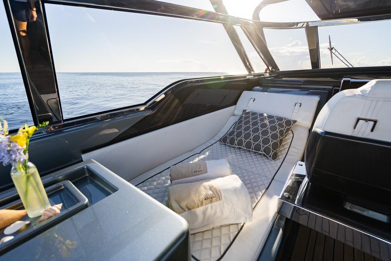 a boat with a blanket on it aboard 2021 RIVA 76' BAHAMAS Yacht for Sale