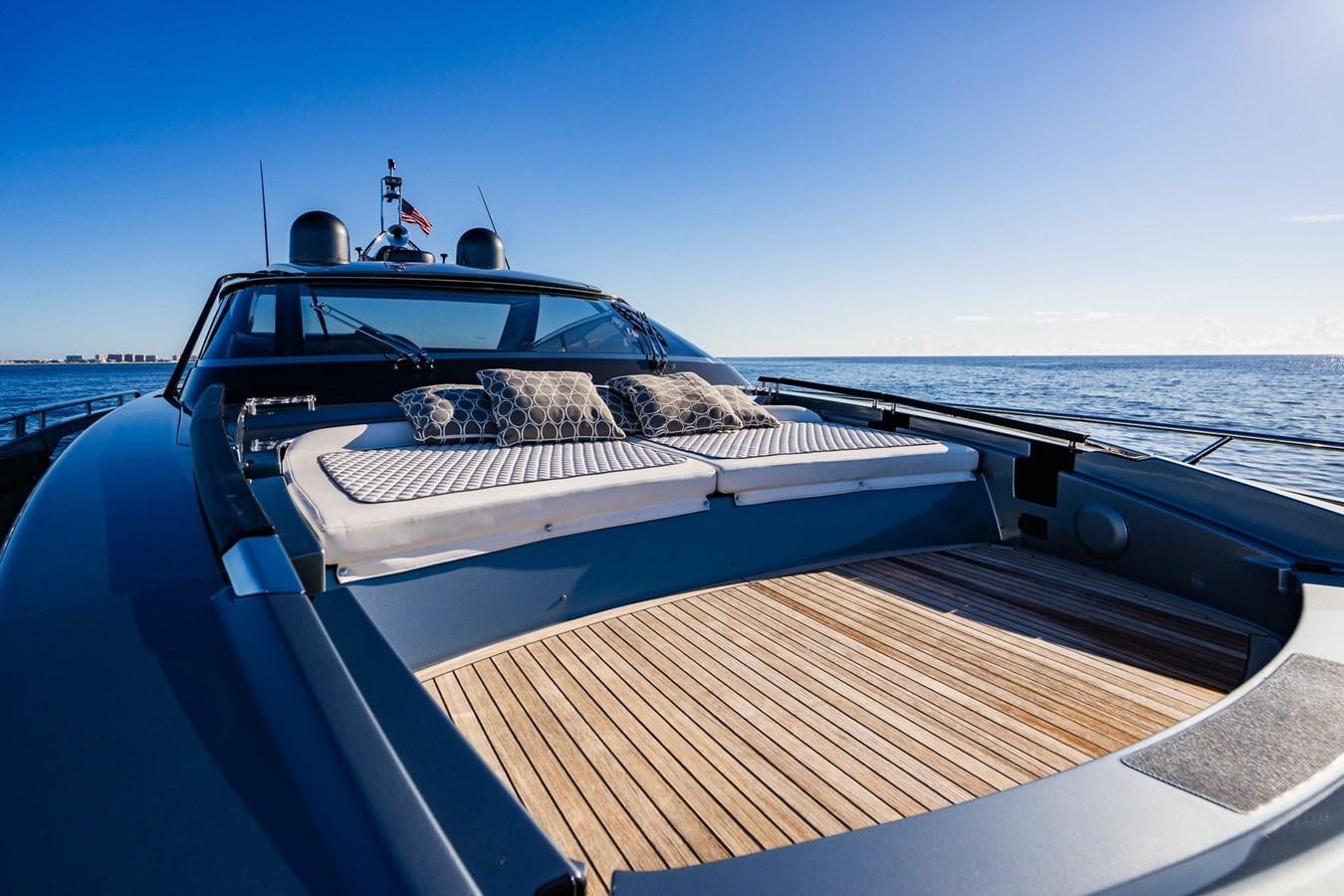 a cat lying on a boat aboard 2021 RIVA 76' BAHAMAS Yacht for Sale