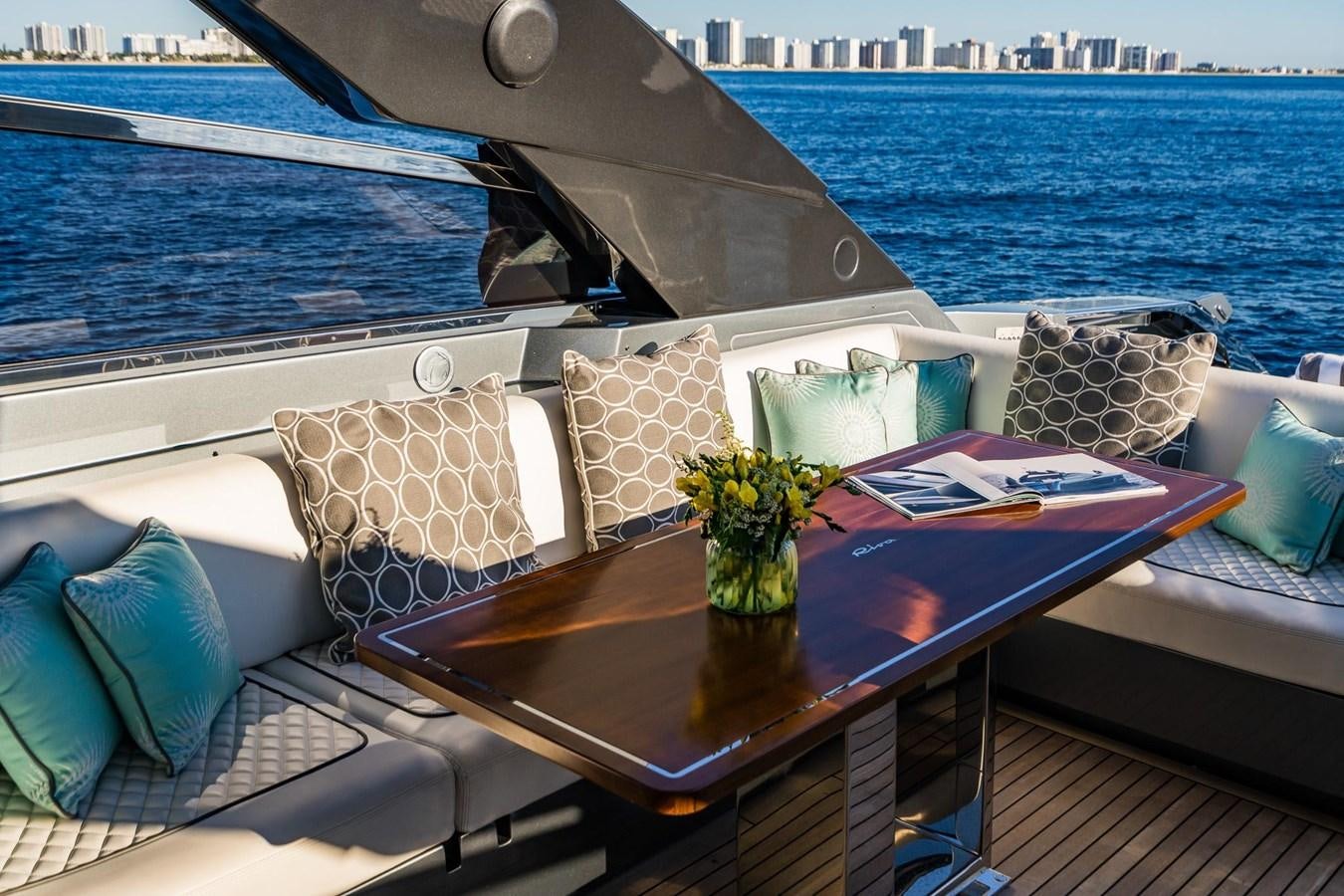 a table with pillows and pillows on it aboard 2021 RIVA 76' BAHAMAS Yacht for Sale