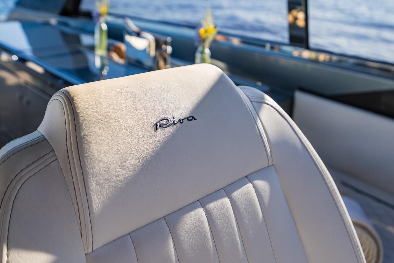 a seat with a flower on the seat aboard 2021 RIVA 76' BAHAMAS Yacht for Sale