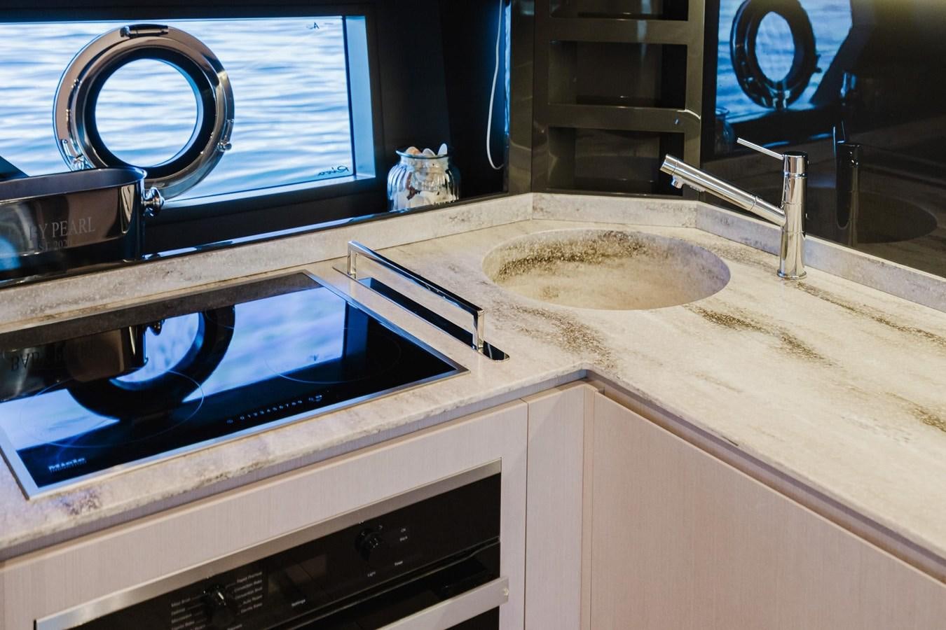 a kitchen sink with a large faucet aboard 2021 RIVA 76' BAHAMAS Yacht for Sale