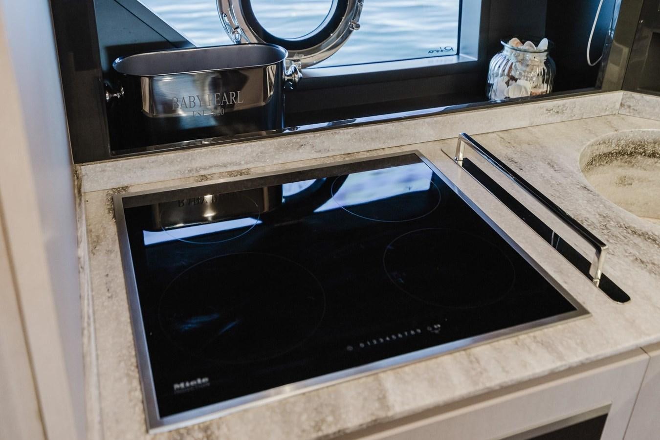 a black rectangular object with a silver object on it aboard 2021 RIVA 76' BAHAMAS Yacht for Sale