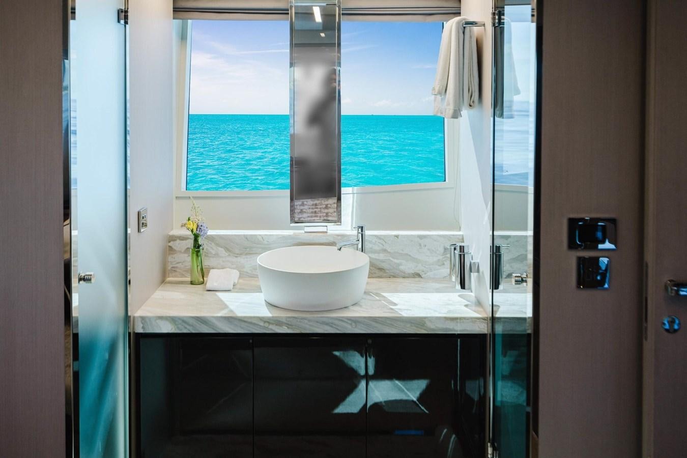 a bathroom with a sink and a large window aboard 2021 RIVA 76' BAHAMAS Yacht for Sale