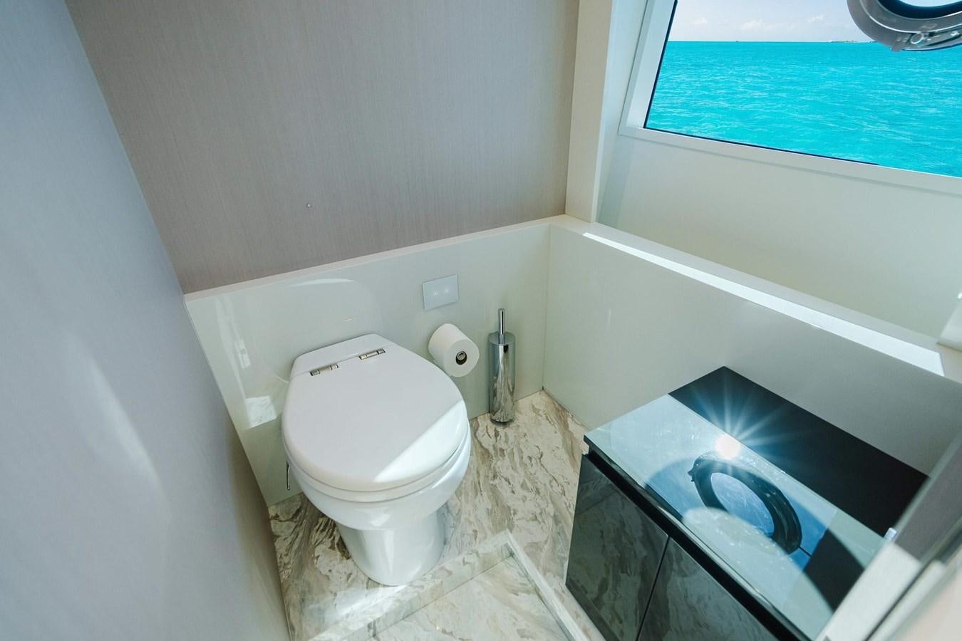 a bathroom with a broken toilet aboard 2021 RIVA 76' BAHAMAS Yacht for Sale