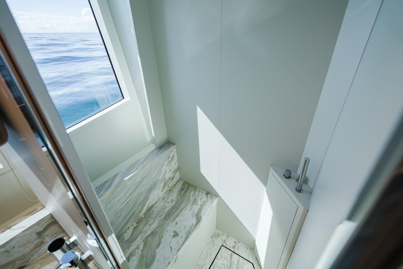 a room with a window and a sink aboard 2021 RIVA 76' BAHAMAS Yacht for Sale