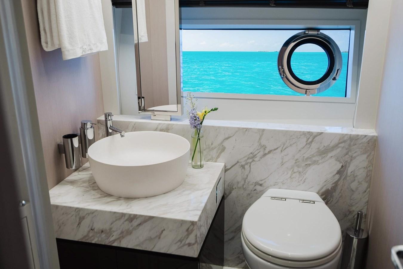 a bathroom with a sink and a toilet aboard 2021 RIVA 76' BAHAMAS Yacht for Sale