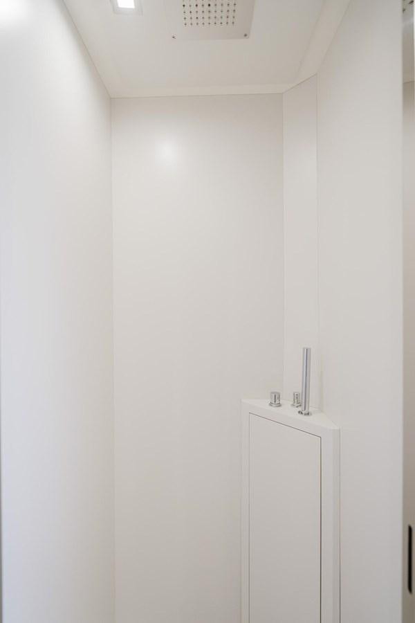a white wall with a light switch aboard 2021 RIVA 76' BAHAMAS Yacht for Sale