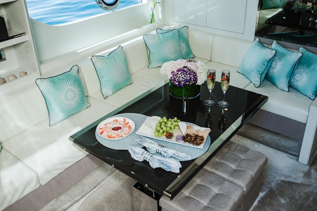 a table with food on it aboard 2021 RIVA 76' BAHAMAS Yacht for Sale