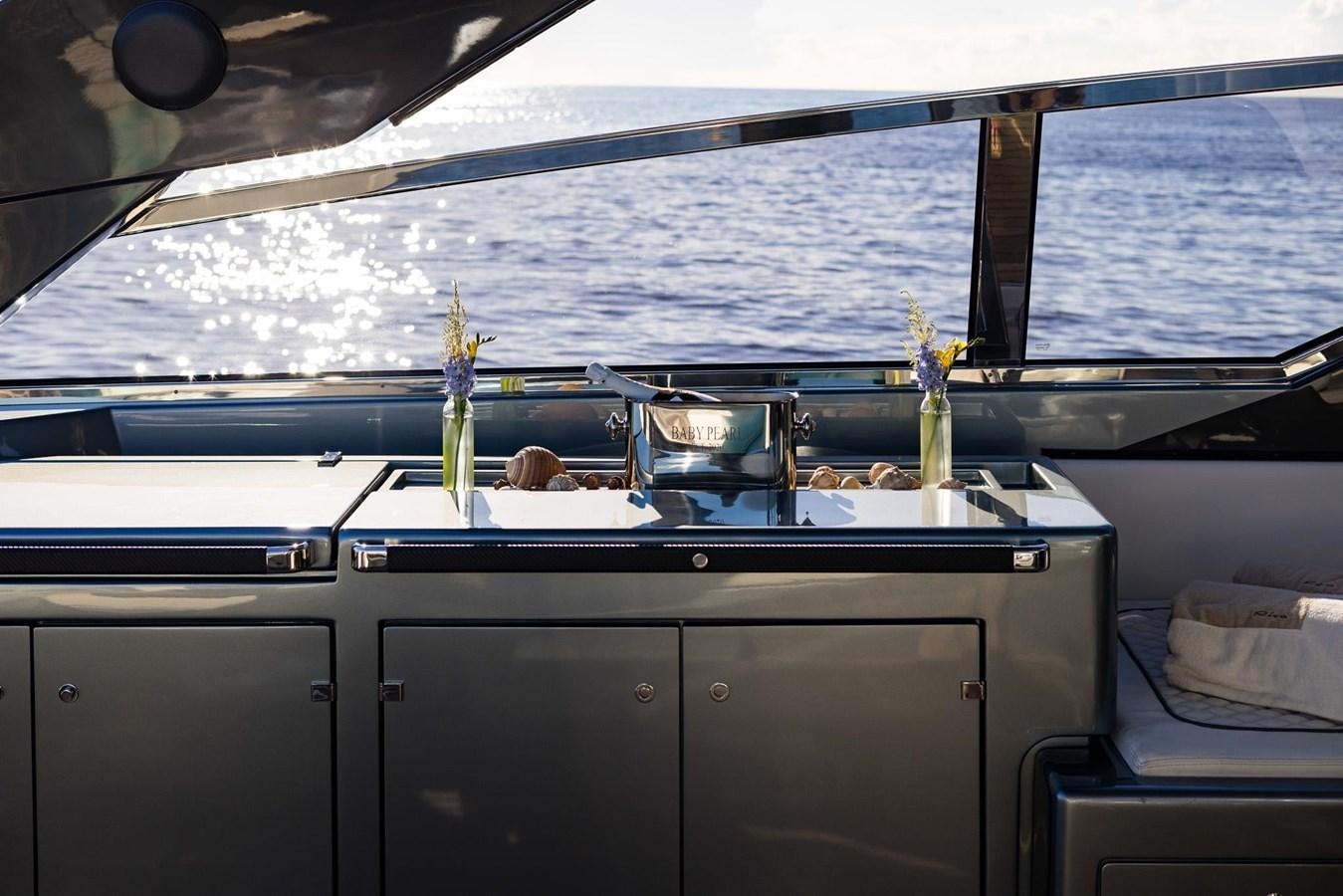 a black counter top with a plant in it aboard 2021 RIVA 76' BAHAMAS Yacht for Sale