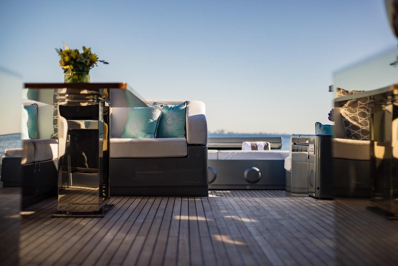 a room with a couch and a table aboard 2021 RIVA 76' BAHAMAS Yacht for Sale