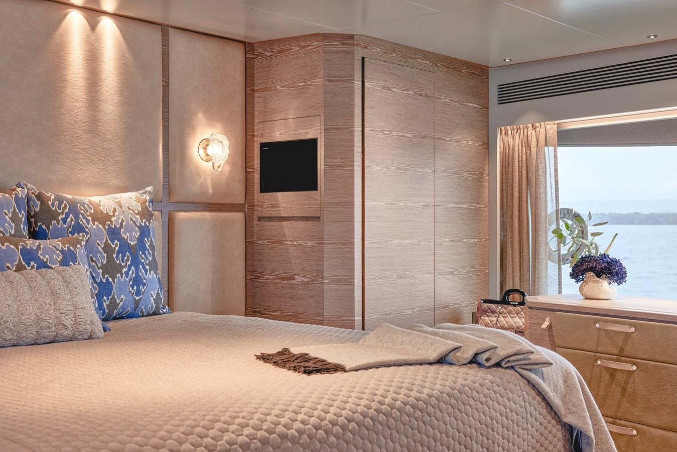 a bed in a room aboard ASKARI Yacht for Sale