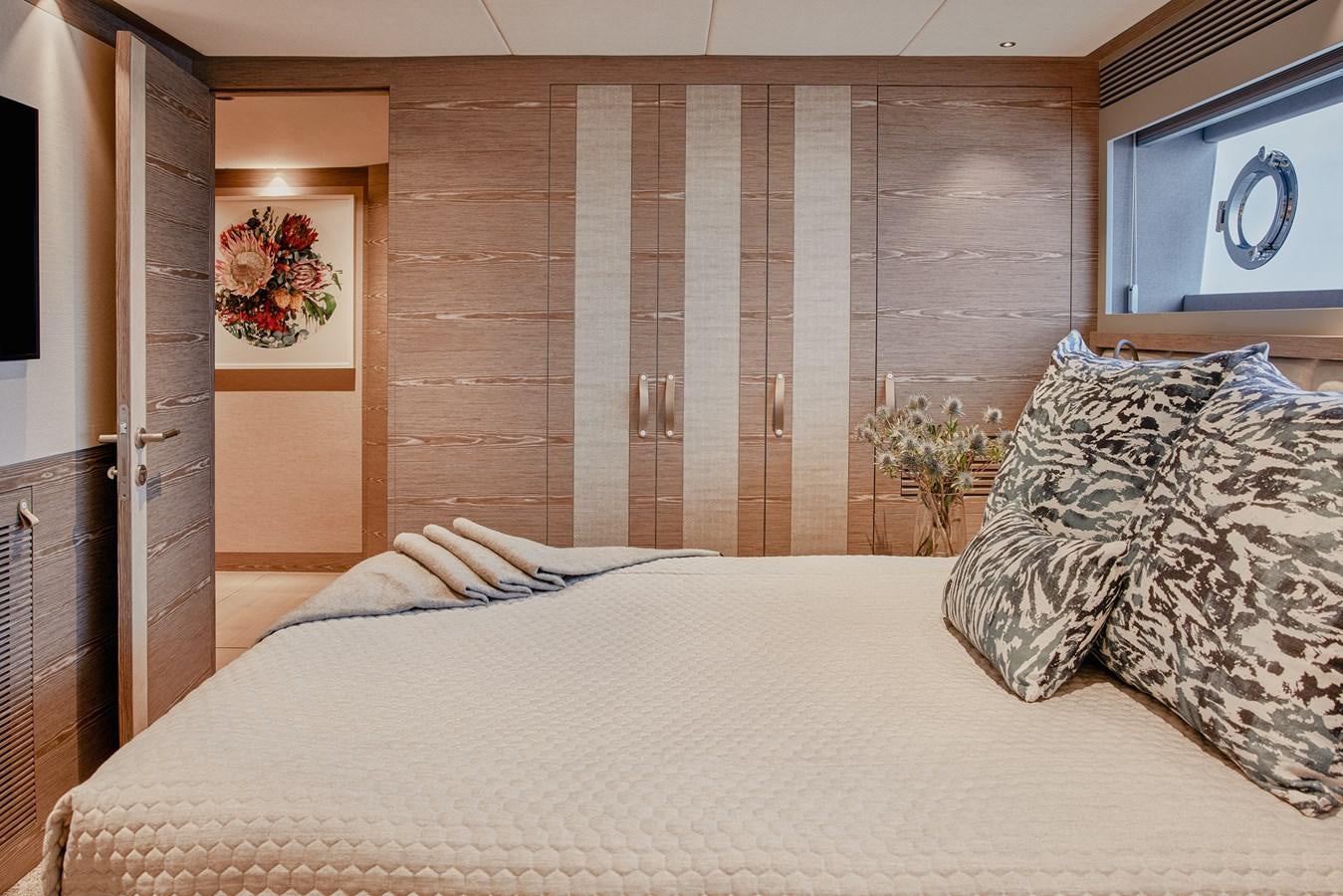 a bed with a white sheet aboard ASKARI Yacht for Sale