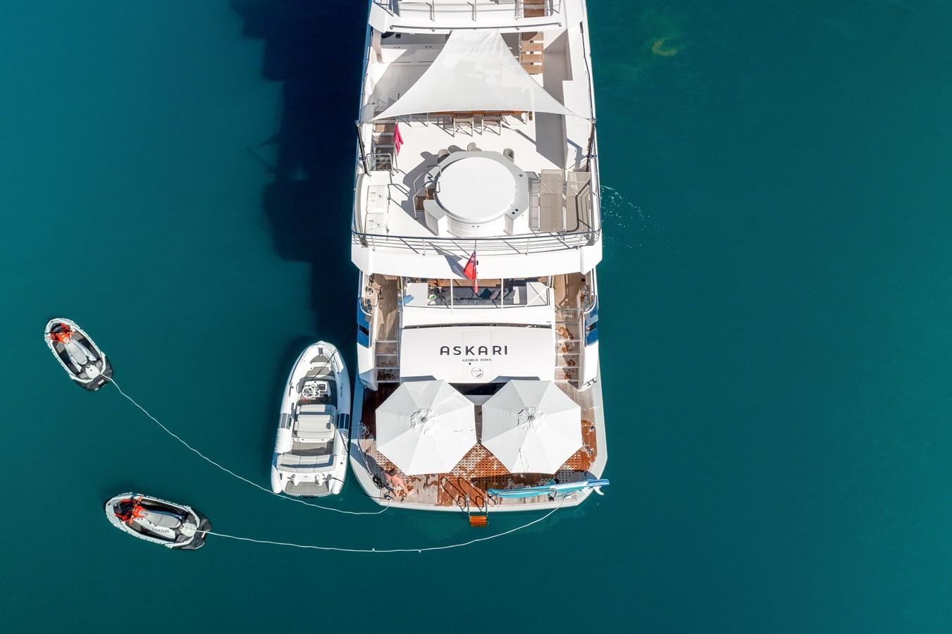 a small boat on the water aboard ASKARI Yacht for Sale
