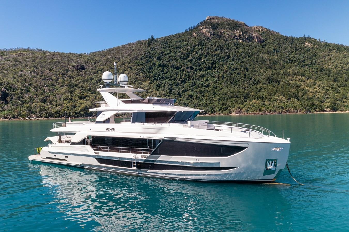 a white yacht in the water aboard ASKARI Yacht for Sale