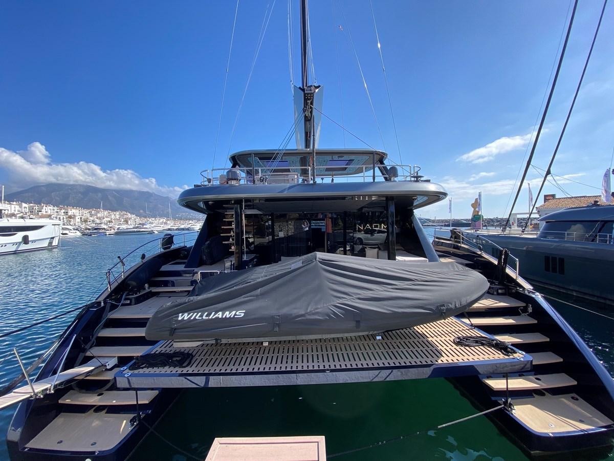 a boat docked at a pier aboard NAOMA Yacht for Sale