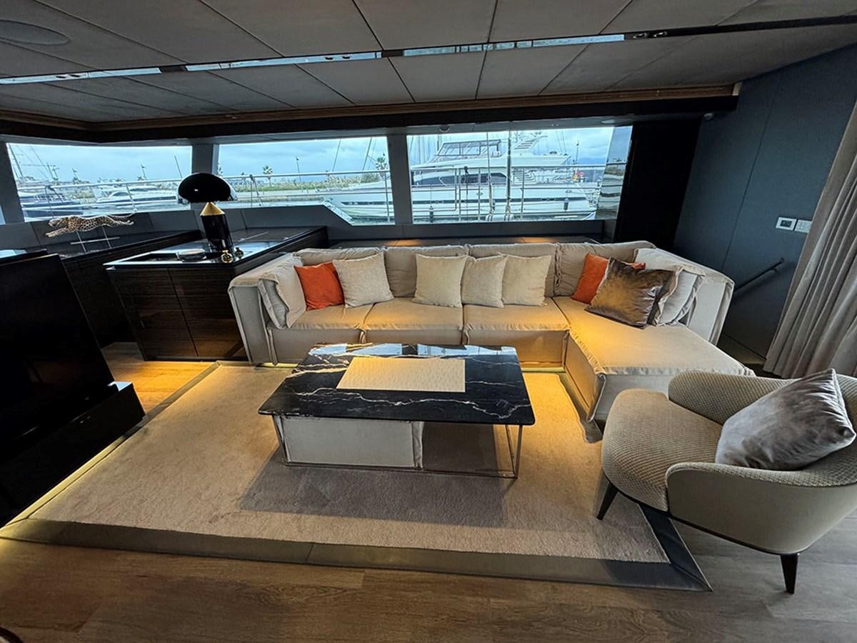 a living room with a large window aboard NAOMA Yacht for Sale