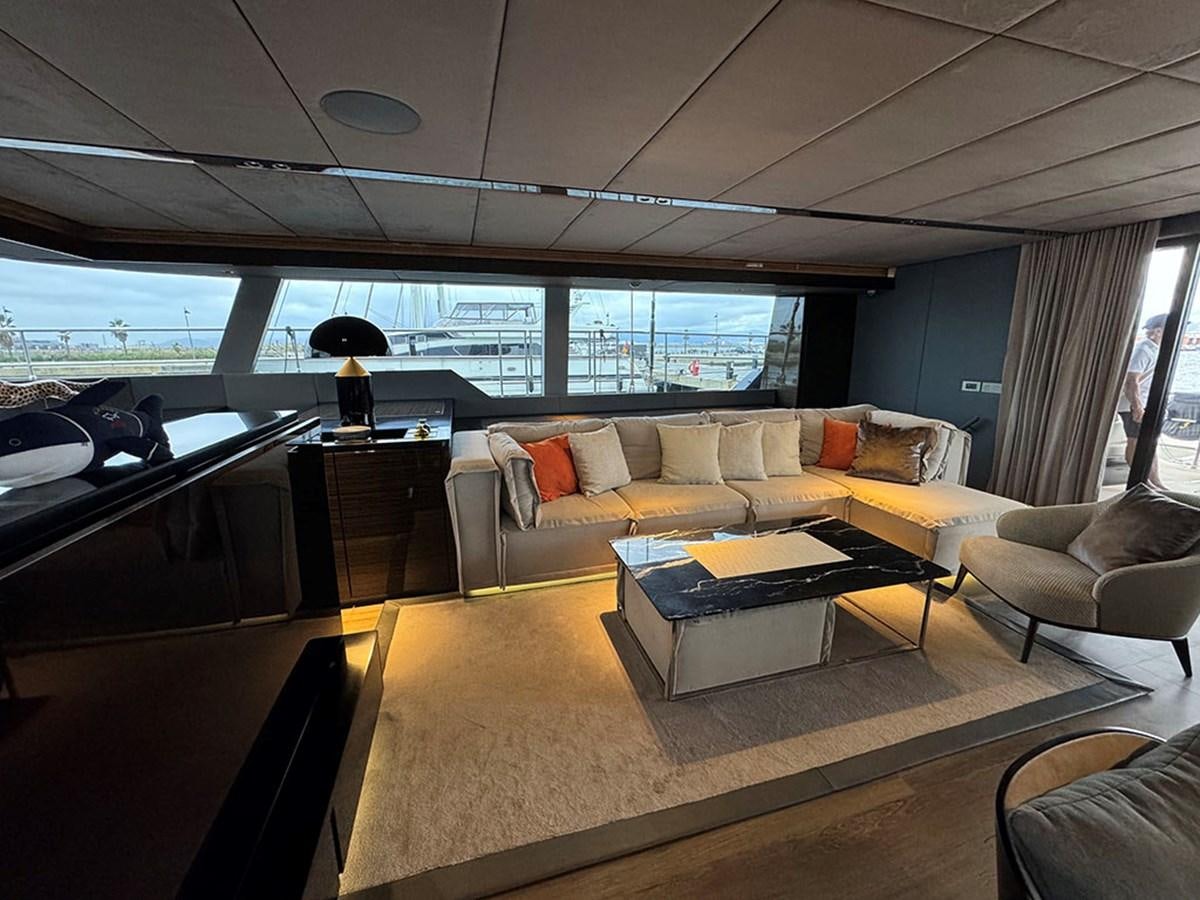 a living room with a couch and a coffee table aboard NAOMA Yacht for Sale