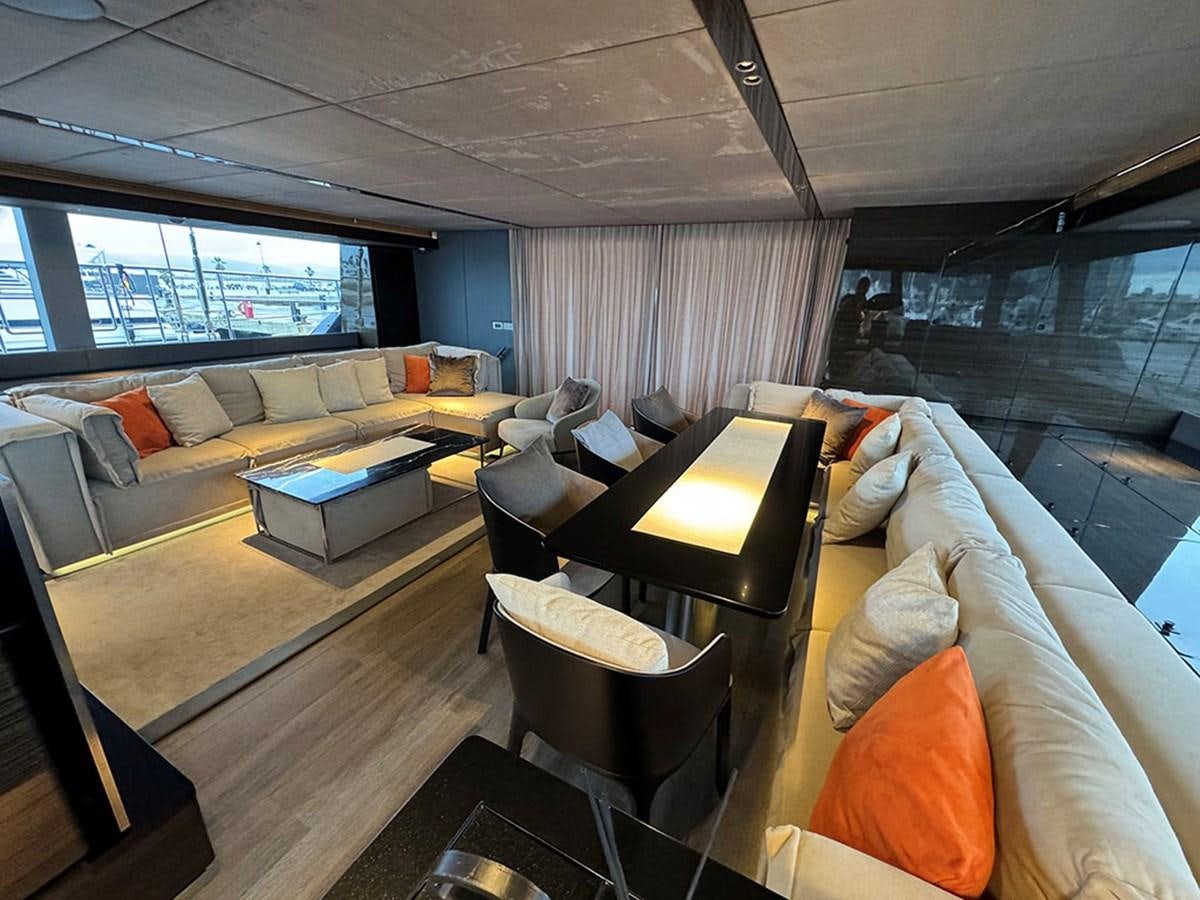 a living room with a large window aboard NAOMA Yacht for Sale