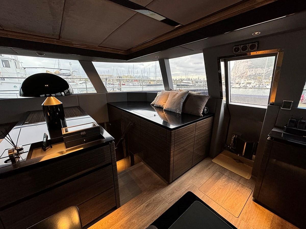 a room with a bed and a desk aboard NAOMA Yacht for Sale