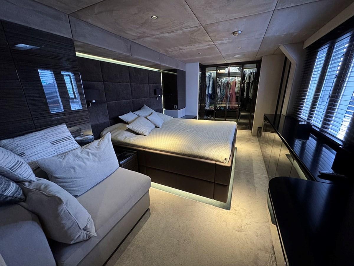 a room with a bed and a couch aboard NAOMA Yacht for Sale