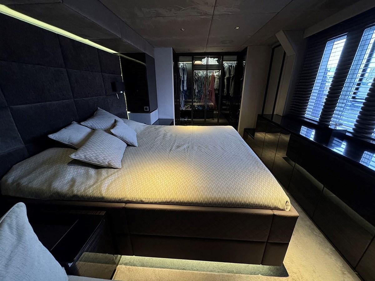 a bed in a room aboard NAOMA Yacht for Sale