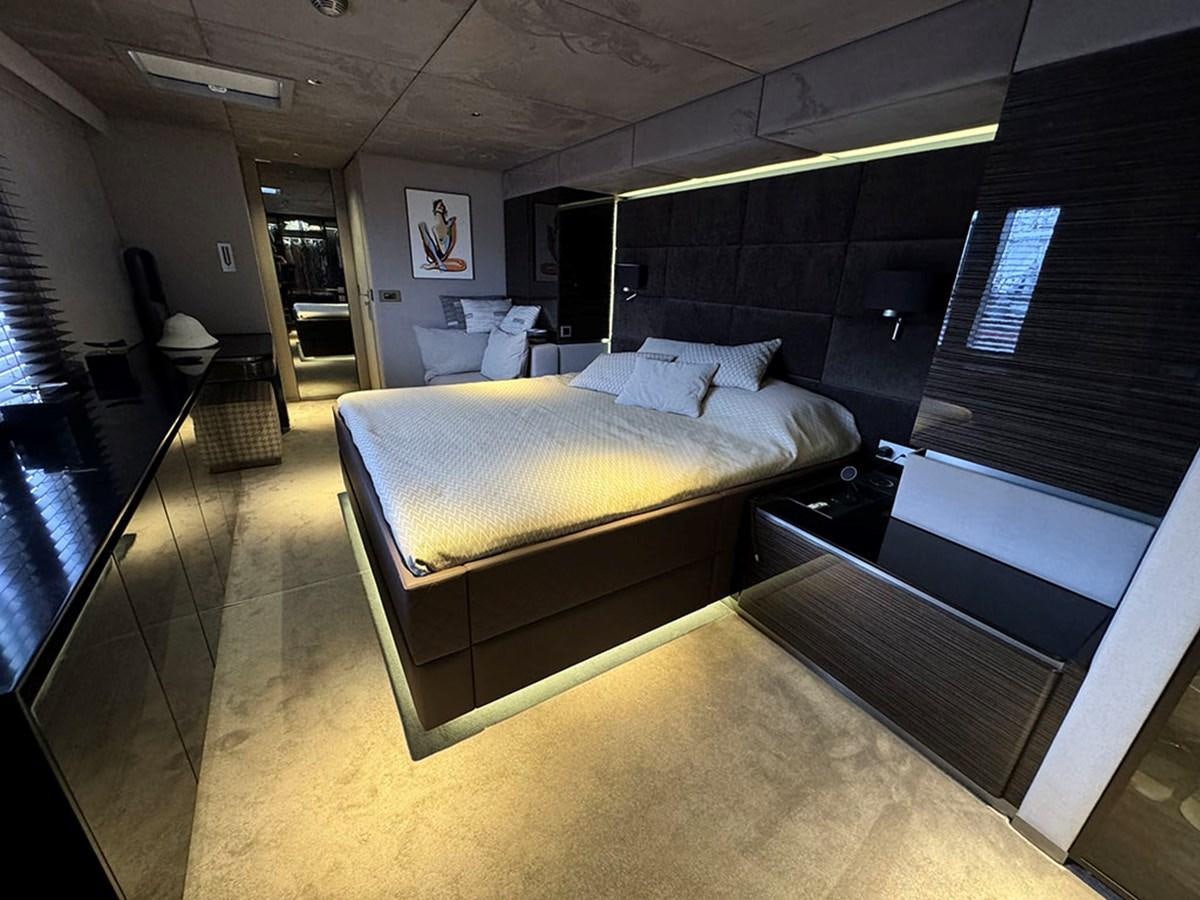 a large bedroom with a bed aboard NAOMA Yacht for Sale