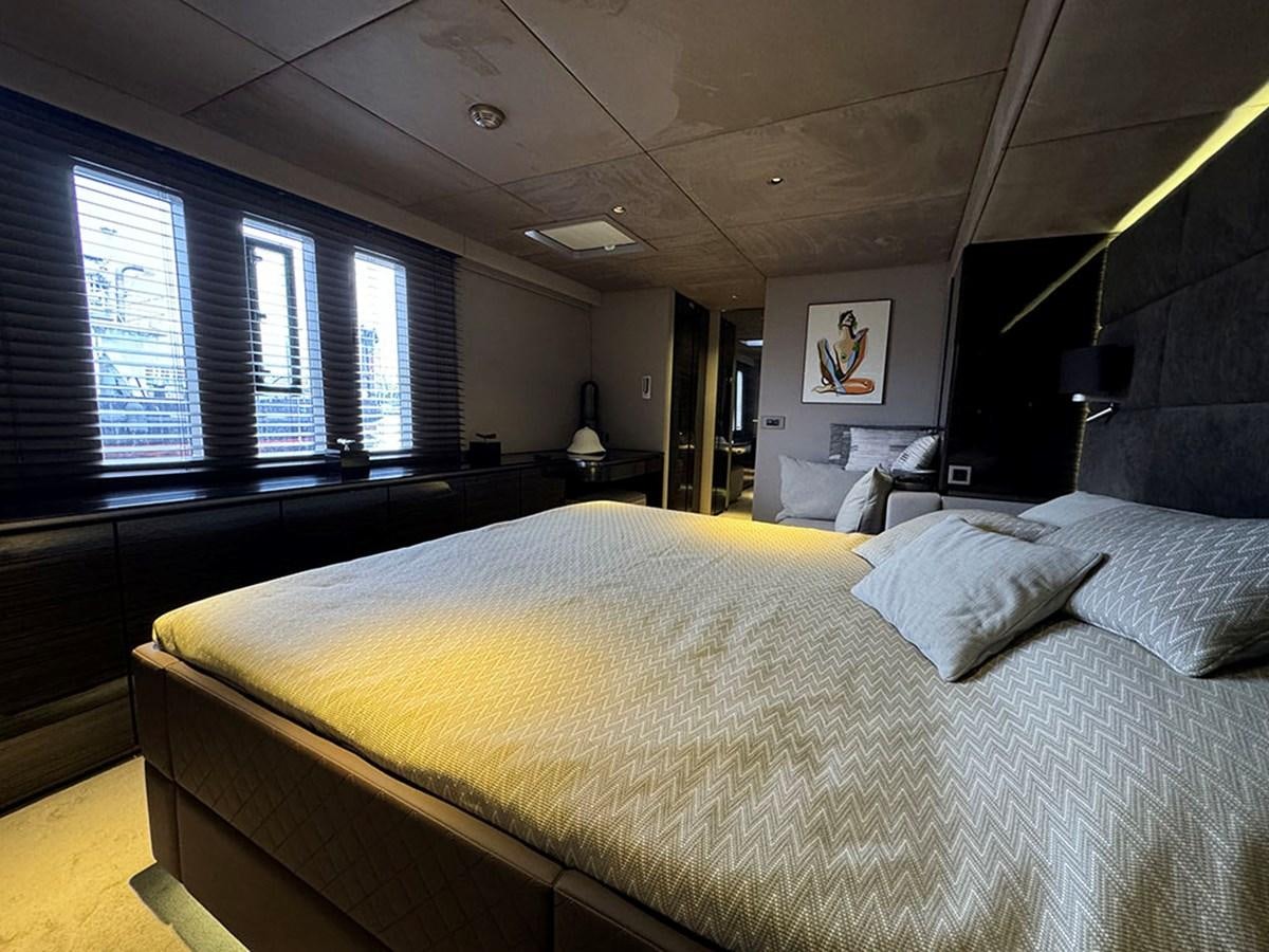 a large bed in a room aboard NAOMA Yacht for Sale