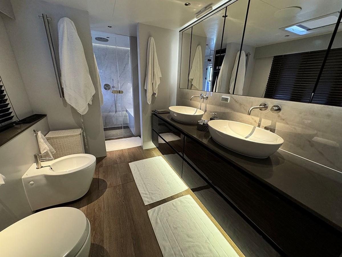 a bathroom with sinks and mirrors aboard NAOMA Yacht for Sale