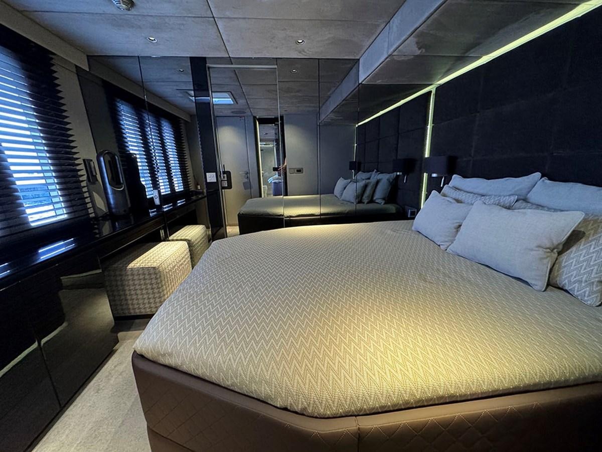 a room with a bed and a table aboard NAOMA Yacht for Sale